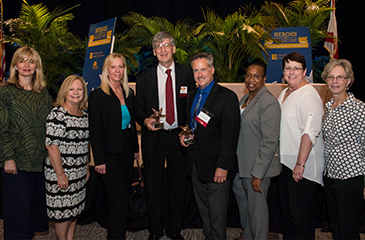 The Health Care District group at the Heroes in Medicine awards stand together for a photo.